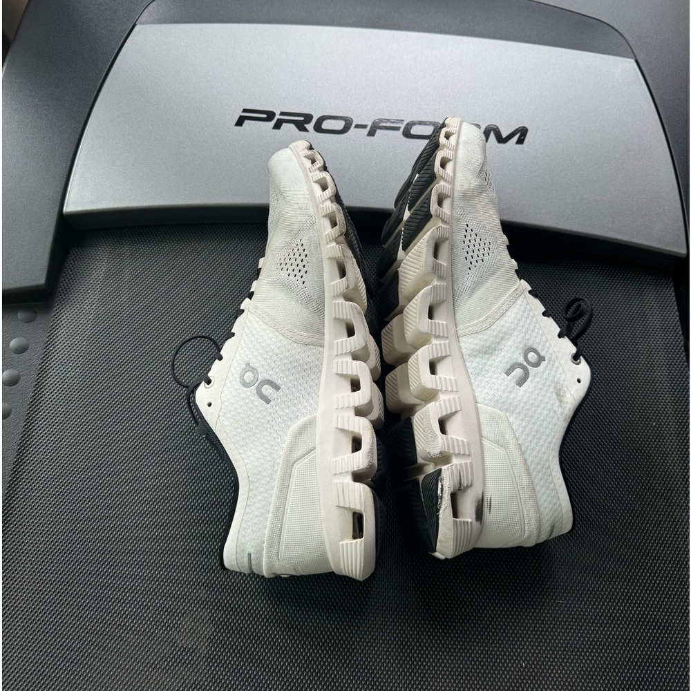 On men’s white sneakers.